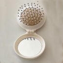 1pc Mini Portable Folding Hair Brush with Integrated Mirror, Scalp Massage Comb with Air Cushion Base for All Hair Types - Travel-Friendly Hair Care Accessory