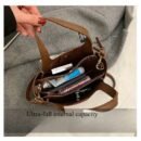 Chic Black Shoulder Bag with Golden-Tone Hardware & Decorative Pendant - Trendy Bucket Style, Versatile for All Occasions, Hand Wash Only, Ladies Handbags