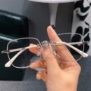 A Pair Of Frameless Transparent Lenses For Women, With A Sparkling Galaxy Frame