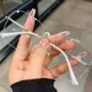 A Pair Of Frameless Transparent Lenses For Women, With A Sparkling Galaxy Frame