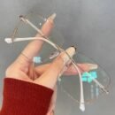 A Pair Of Frameless Transparent Lenses For Women, With A Sparkling Galaxy Frame